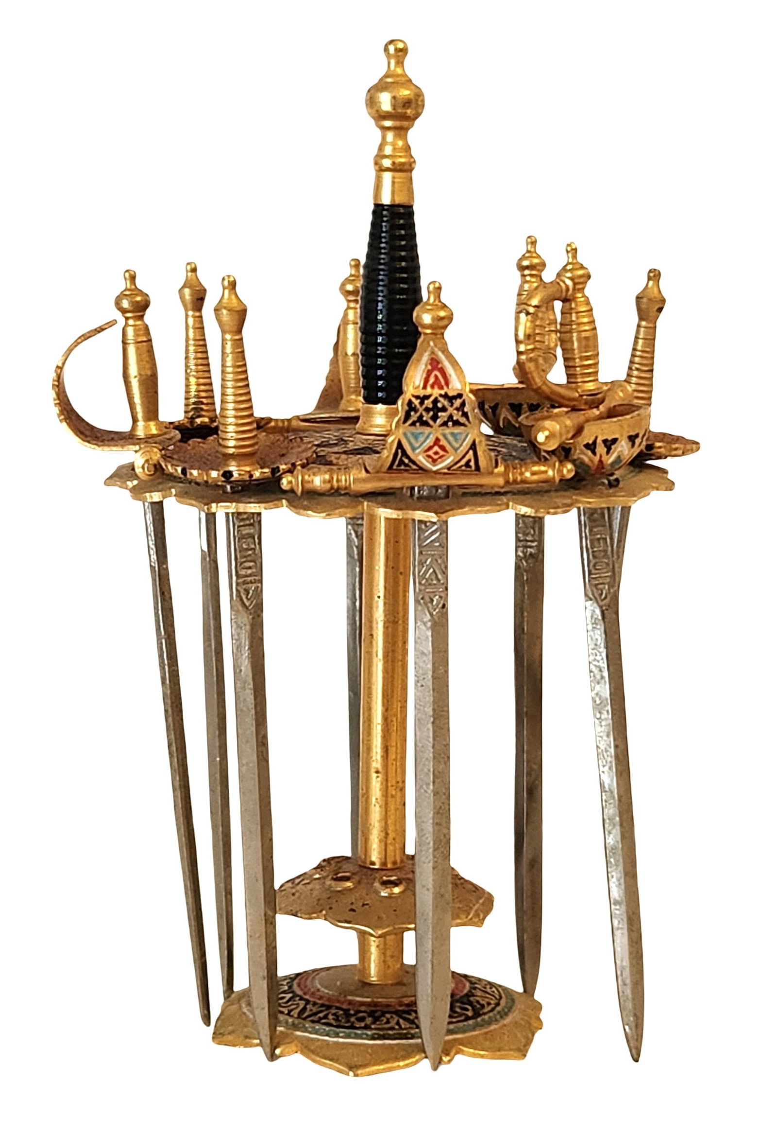 Moroccan-Style Jeweled Dagger Letter Opener Set with Stand: Decorative set of Moroccan-style miniature daggers presented in a fitted display stand. The set includes multiple letter openers with metal blades and ornate handles, some featuring colorful enamel