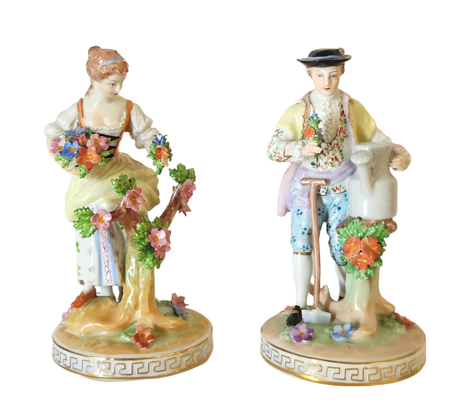 Fine Vintage Carl Thieme Dresden German Figures Man Woman Couple Figurines: A charming pair of 19th-century Continental porcelain figures, each representing a pastoral scene with a young man and woman engaged in gardening. The female figure is shown arranging a basket of colo