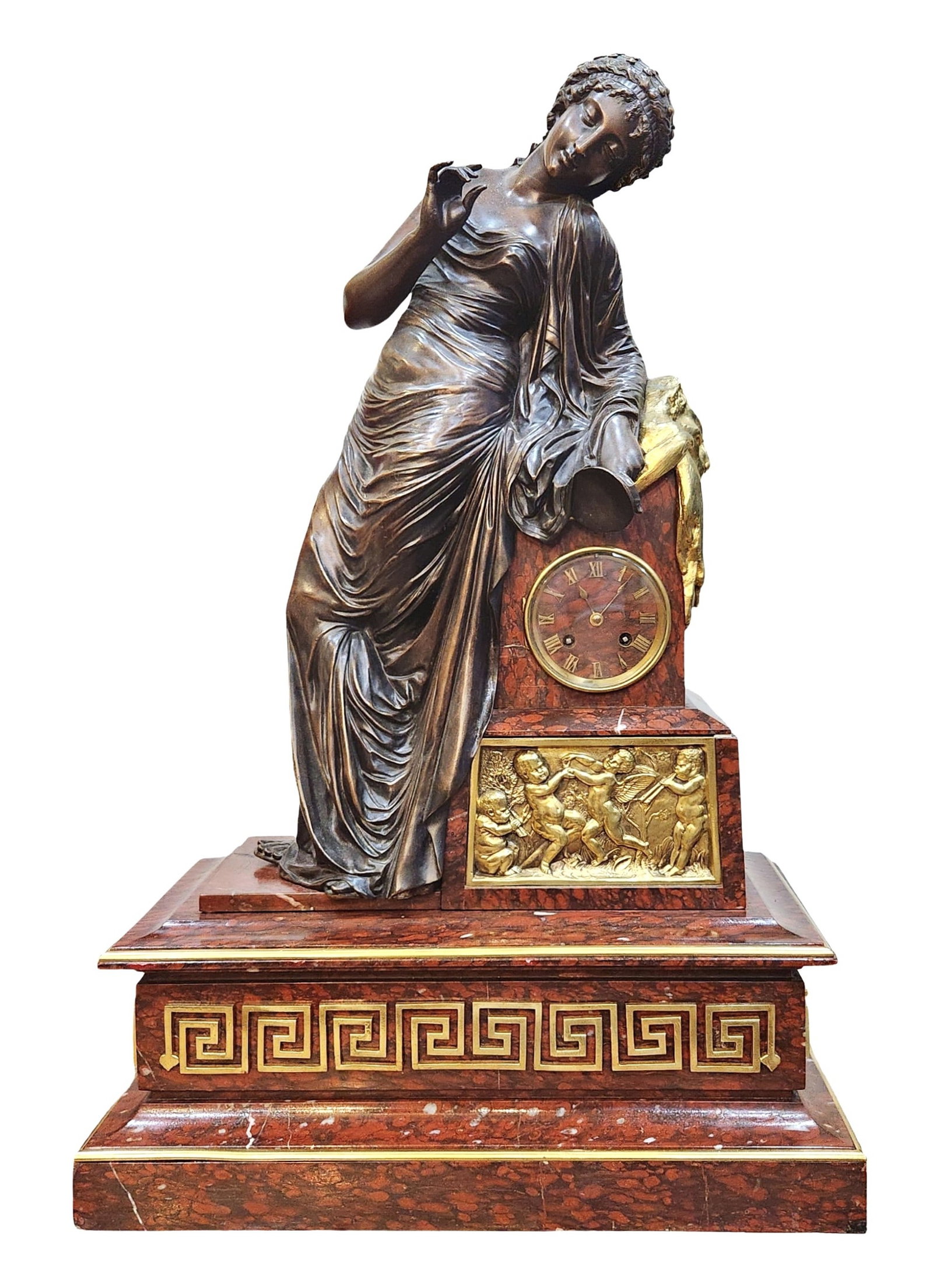 19th Century French Bronze Figural Mantel Clock with Rouge Marble Base: Elegant 19th-century French figural mantel clock featuring a finely cast bronze woman in classical drapery leaning gracefully against a rouge marble pedestal. The clock face is framed in gilt bronze, 