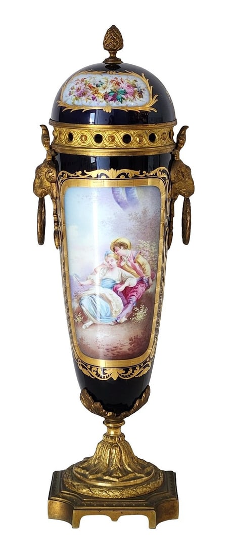 19th Century French Sevres Style Covered Porcelain Vase Signed Daligny ? Ormolu Mounts: An impressive and richly decorated 19th century French Sevres-style covered vase, featuring a finely hand-painted romantic scene signed Daligny on the front panel. The deep cobalt blue porcelain body 