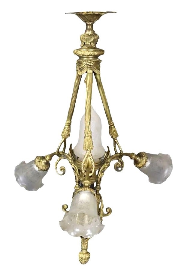 French Louis XVI Style Gilt Bronze Chandelier with Etched Glass Shades: Refined French Louis XVI style chandelier crafted in gilt bronze, exhibiting elegant neoclassical design elements. The fixture features a symmetrical arrangement of gracefully scrolling arms adorned w