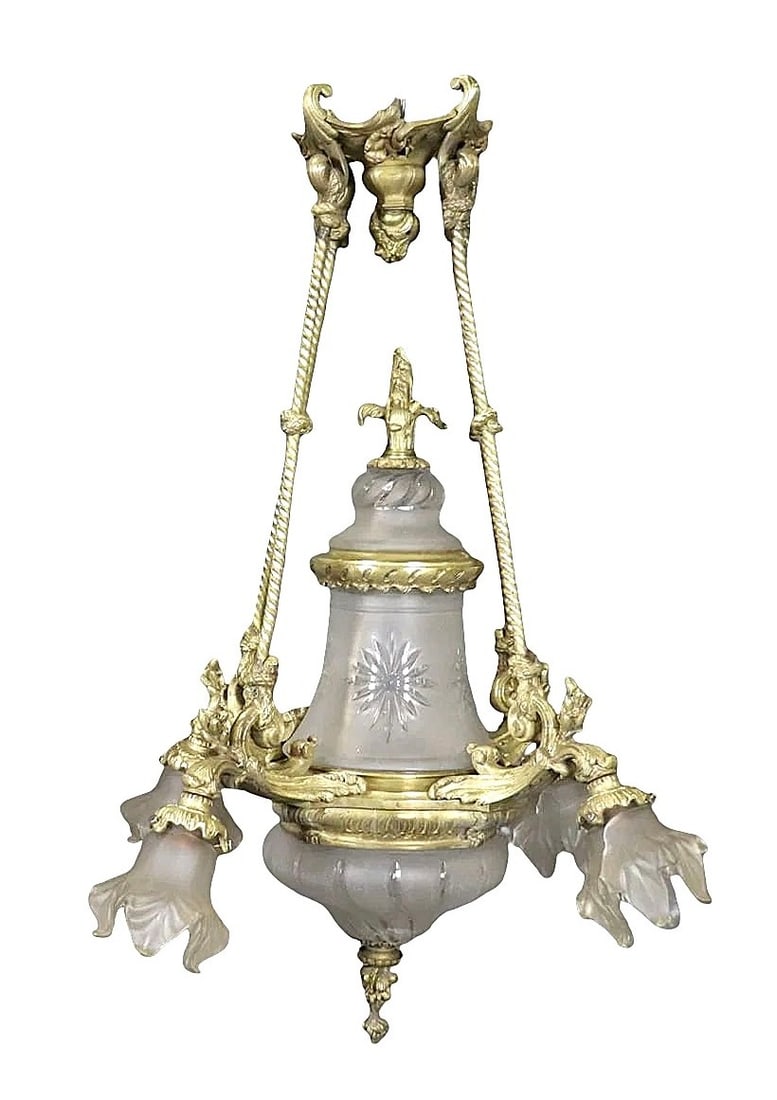 French Louis XVI Style Gilt Bronze and Frosted Glass Chandelier: Elegant French Louis XVI style chandelier crafted in gilt bronze, showcasing refined neoclassical design. The fixture features a central frosted glass body decorated with etched starburst motifs, surr