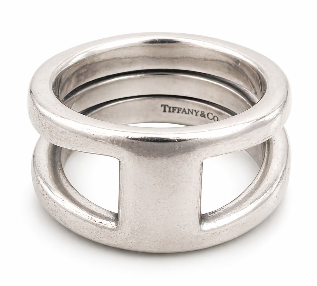 Tiffany & Co. Sterling Silver Crisscross Band Ring, Italy: Modern Tiffany & Co. sterling silver ring featuring a sculptural crisscross or crossover design with smooth, rounded bands that interweave to create an open, dimensional form. The minimalist yet bold 