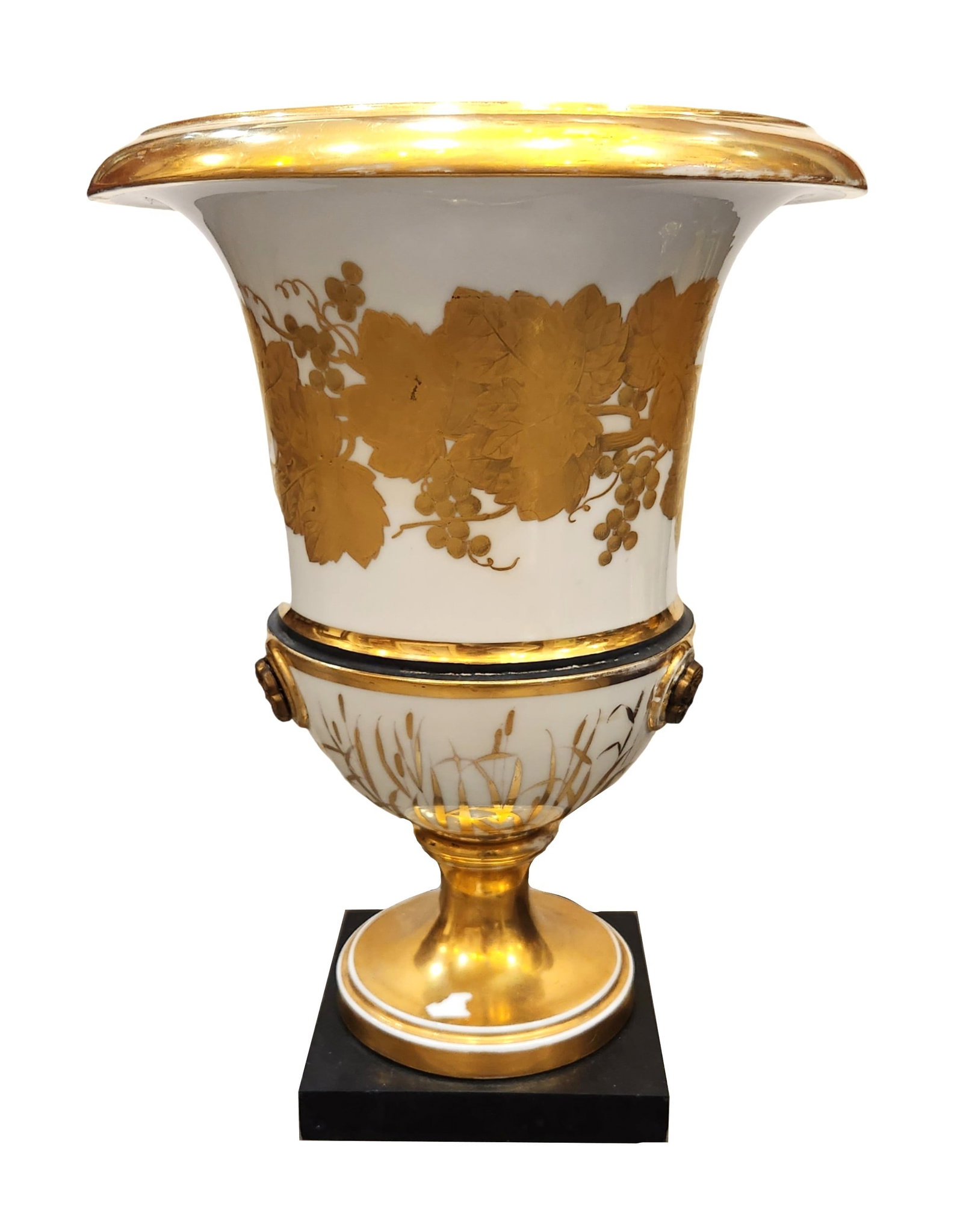 Empire Style Gilt Porcelain Campana Urn on Pedestal Base: Elegant Empire style porcelain campana urn, richly decorated with hand-applied gilt grapevine and wheat motifs. The flared rim, pedestal base, and finely molded lion mask handles are all enhanced with