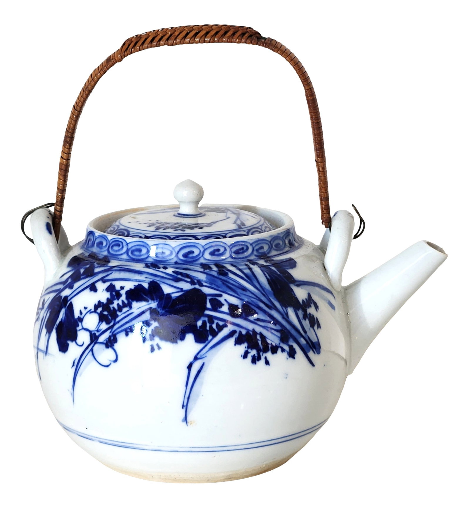 Chinese Blue & White Porcelain Teapot with Woven Handle: Chinese blue and white porcelain teapot decorated in cobalt underglaze with hand-painted floral and botanical motifs. The rounded body features stylized flowering branches and foliage, while the lid a