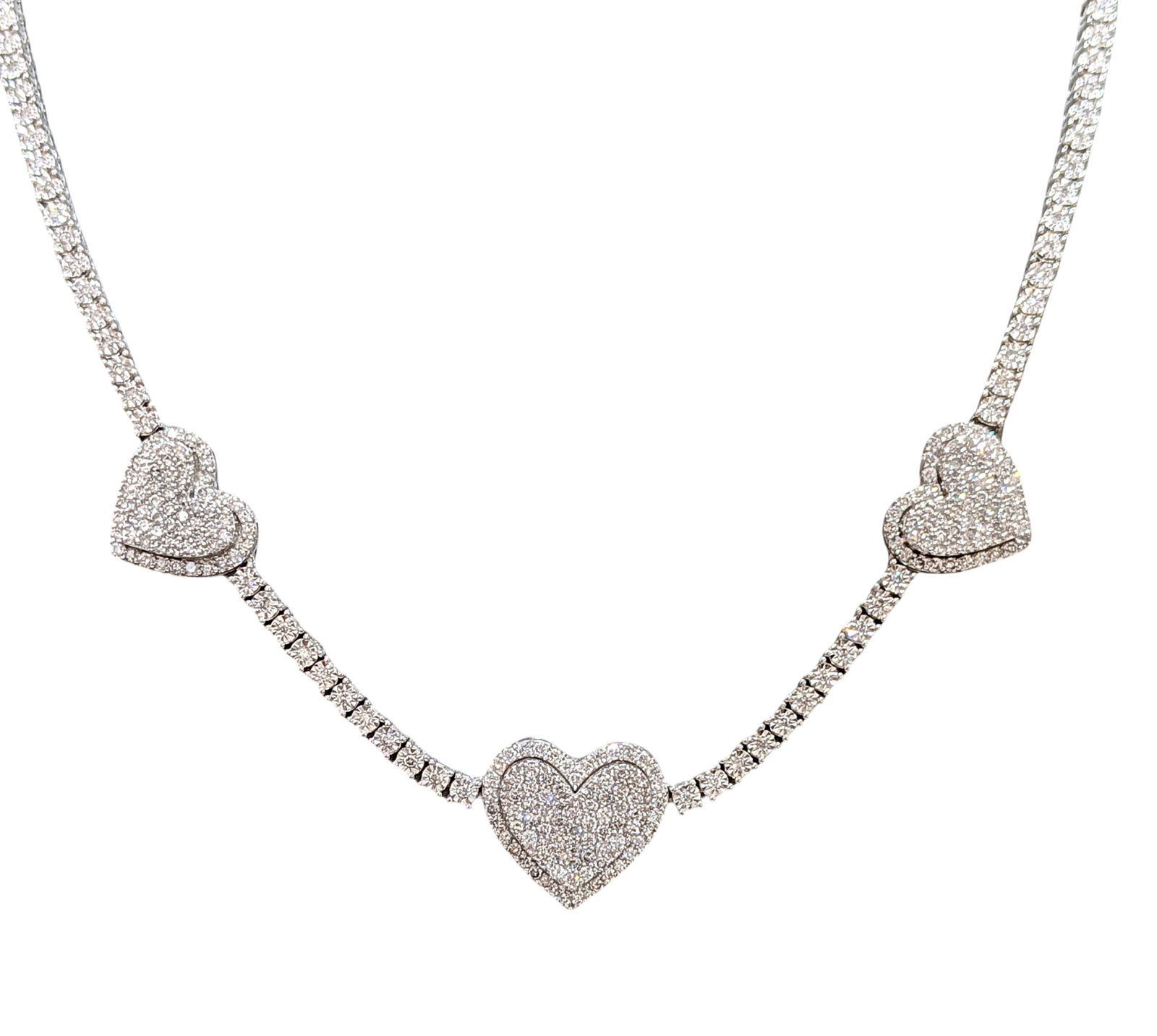 10KT White Gold Diamond Tennis Necklace with Triple Pave Heart Stations, 3.75 CTW: Beautiful diamond tennis necklace crafted in solid 10KT white gold featuring three dazzling pav? diamond heart stations. This elegant piece combines the timeless brilliance of a tennis necklace with r