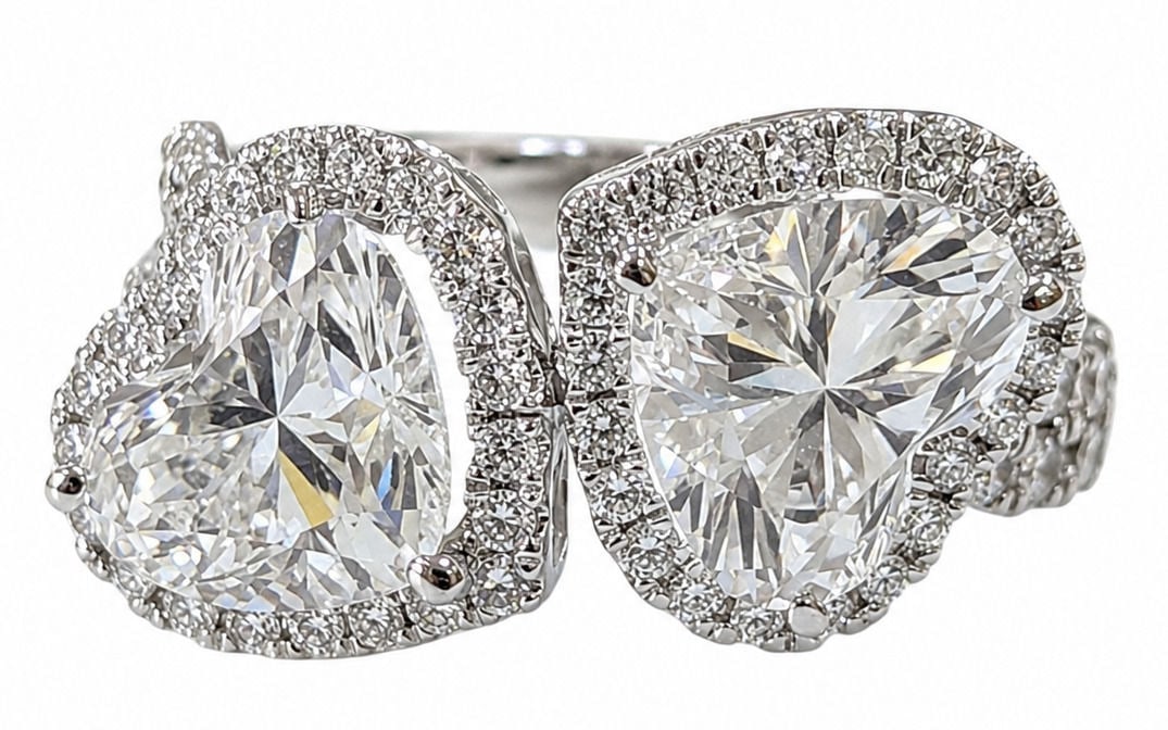 IGI Certified Laboratory Grown Diamond Ring in 14K White Gold ? Pear & Heart Cut Halo Design: Elegant Toi et Moi ( You and Me ) design Diamond Details: Main Stone Shapes: Heart Cut & Pear Cut Total Main Stone Weight: 2.01 Carats Accent Diamond Weight: 0.82 Carats Total Diamond Type: Laboratory