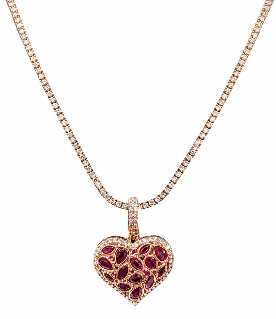 Diamond Tennis Necklace with Ruby Heart Pendant in 14K Rose Gold: Necklace Details: Diamond Weight: Approx. 3.29 Carats Metal: 14K Rose Gold Weight: 13.2 Grams Length: 18 Inches Style: Diamond Tennis Necklace Clasp: Box Clasp with Safety Lock Pendant Details: Metal: