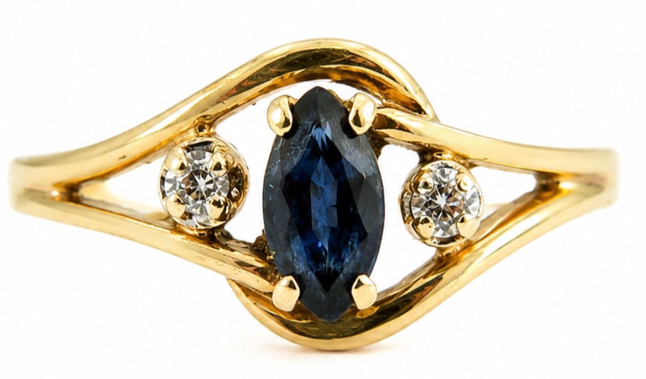 14K Yellow Gold Sapphire & Diamond Ring Marquise Blue Sapphire Estate Ring: 14K Yellow Gold Size 7 3/4 Weight 1.4g Total Gemstone Weight: Approx. 0.35 CTW Center Stone: Marquise-Cut Blue Sapphire Accent Stones: 2 Round Diamonds Style: Sapphire & Diamond Ring