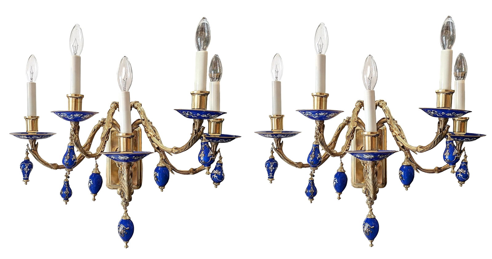 Pair of Louis XVI Style Four-Light Gilt Bronze and Cobalt Blue Porcelain Wall Sconces: Elegant pair of Louis XVI-style four-light wall sconces crafted in gilt metal with richly detailed cobalt blue porcelain accents. Each sconce features four scrolling arms supporting candle-form socket