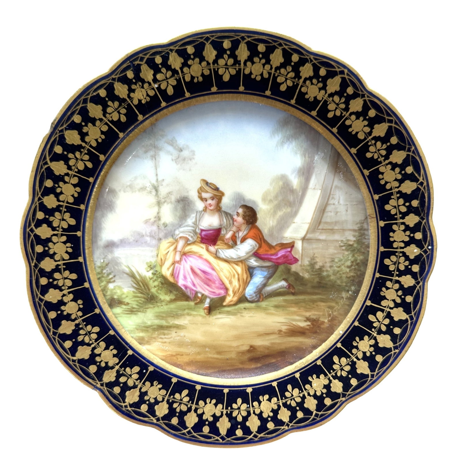 French Sevres Hand-Painted Porcelain Plate with Cobalt Border, Signed Boucher: Elegant French Sevres porcelain cabinet plate featuring a beautifully hand-painted romantic scene of a couple seated in a lush garden landscape. The finely detailed artwork is signed "Boucher" on the 