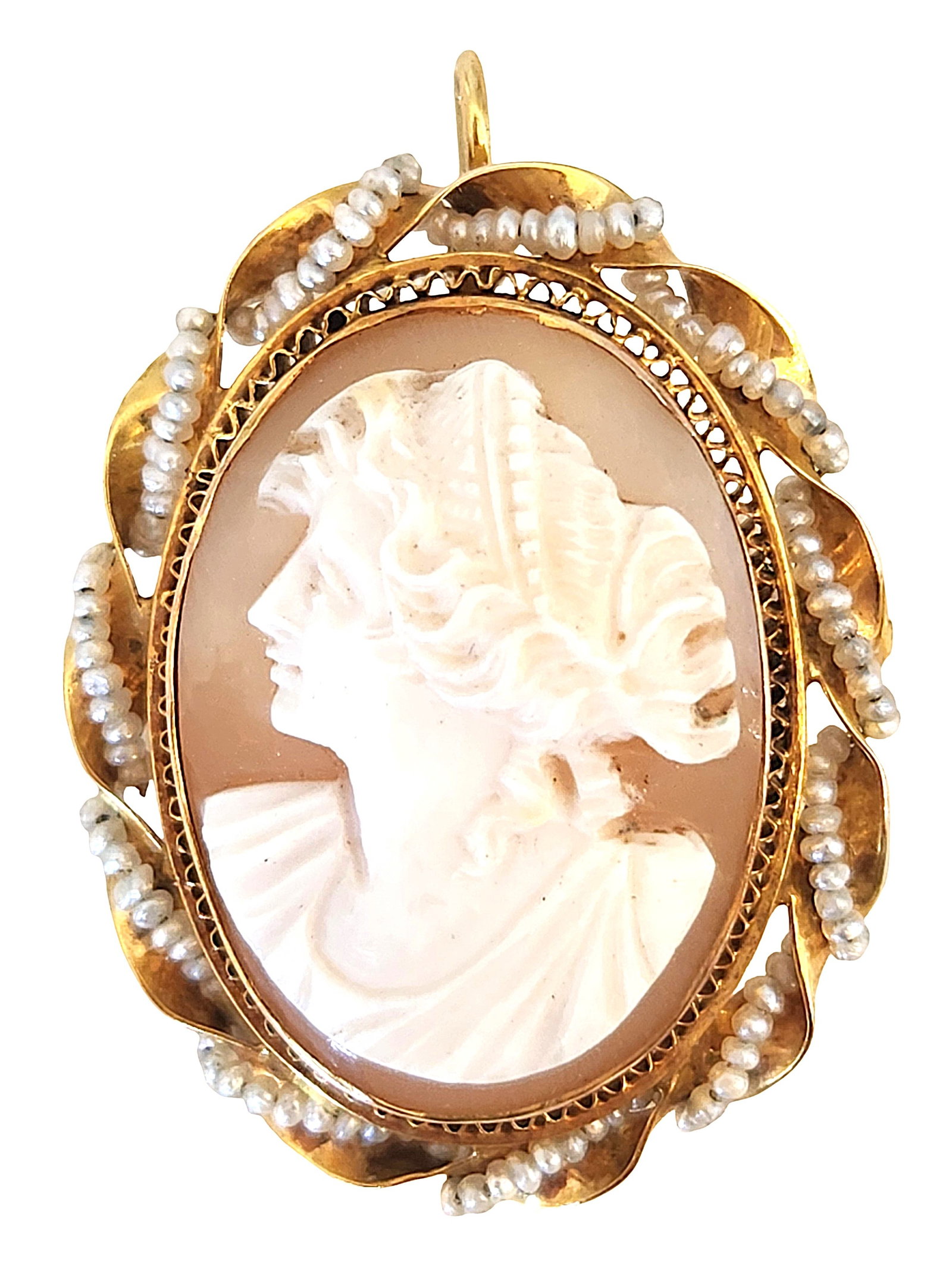 Antique 10K Cameo Brooch or Pendant with Seed Pearl Accents: Dating to the Mid- Century period, this cameo represents all the traditions of cameo carving, with a modern era twist. The frame is simple, a ribbon of gold with simply strung seed pearls that shines 