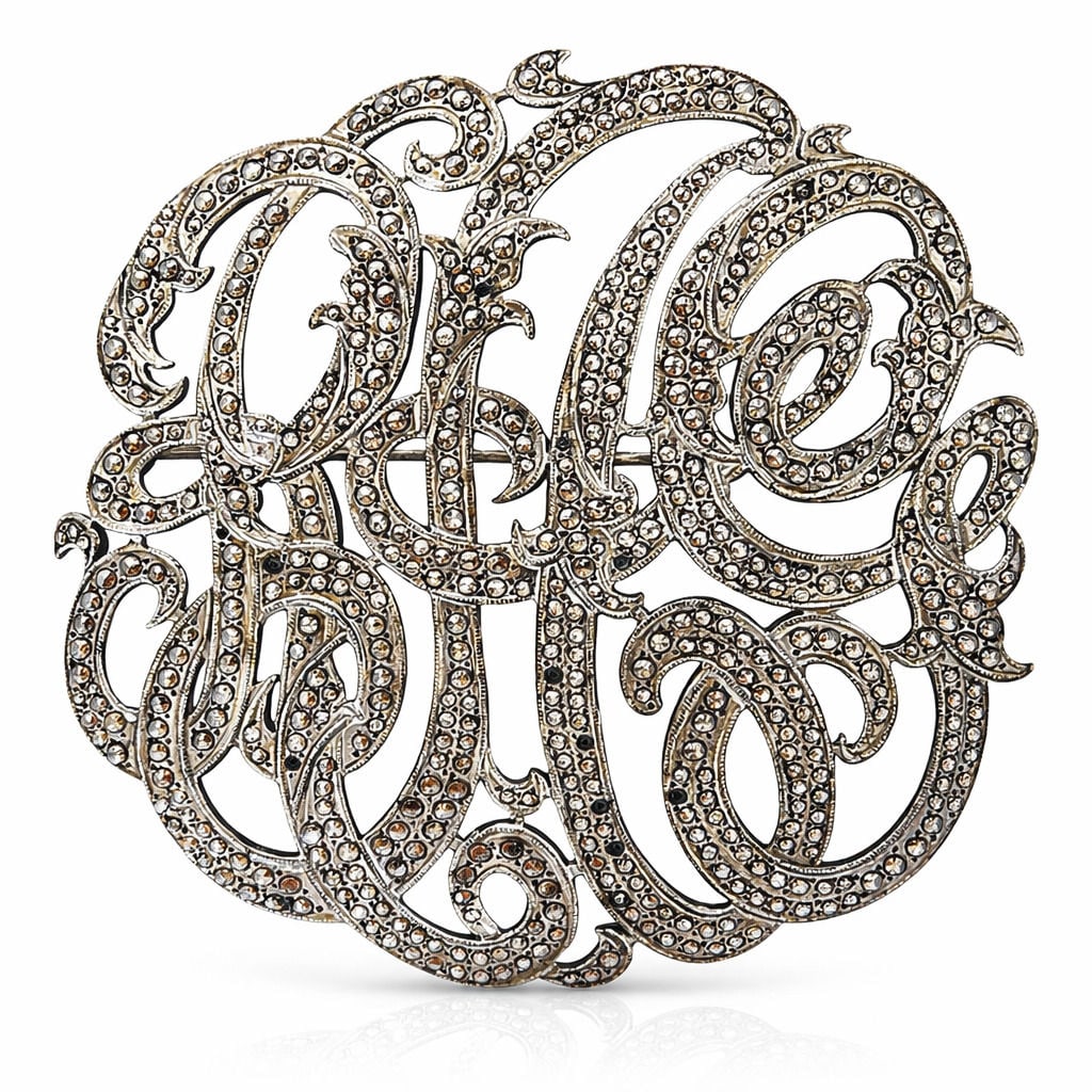 Antique Victorian Sterling Silver Rhinestone Monogram Pin/Brooch: Elegant vintage sterling silver monogram brooch featuring an ornate intertwined script letter design fully set with sparkling marcasite stones. The flowing calligraphic style creates a decorative mono