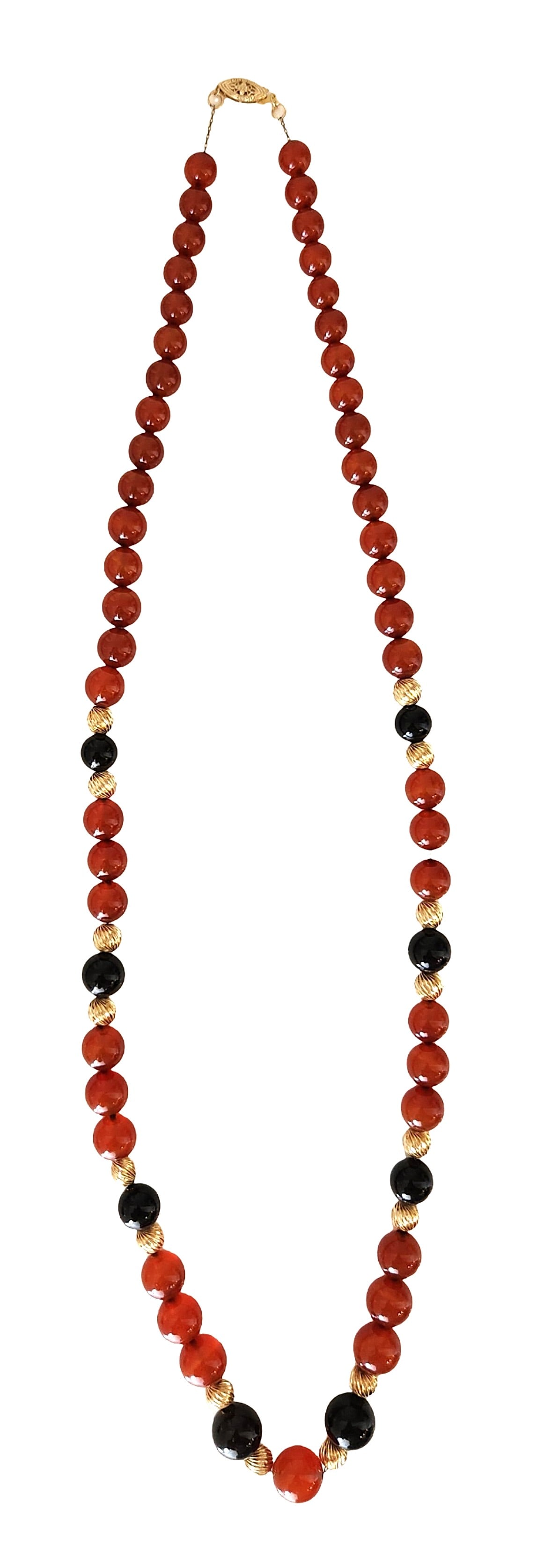 Vintage 14K Gold Carnelian & Black Onyx Beaded Necklace: Elegant vintage beaded necklace featuring rich carnelian gemstone beads accented with black onyx beads and decorative 14K yellow gold spacer beads. The warm reddish-orange tones of the carnelian contr