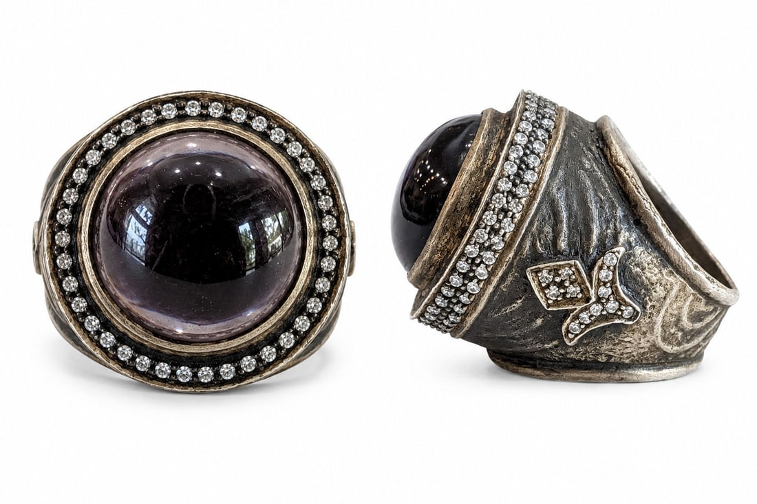 Vintage Sterling Silver Amethyst Cabochon & CZ Statement Ring Size 8.5 (925): Striking vintage sterling silver statement ring featuring a large domed cabochon gemstone in a rich purple hue, likely amethyst, surrounded by pave-set clear stones. The substantial handcrafted-style 
