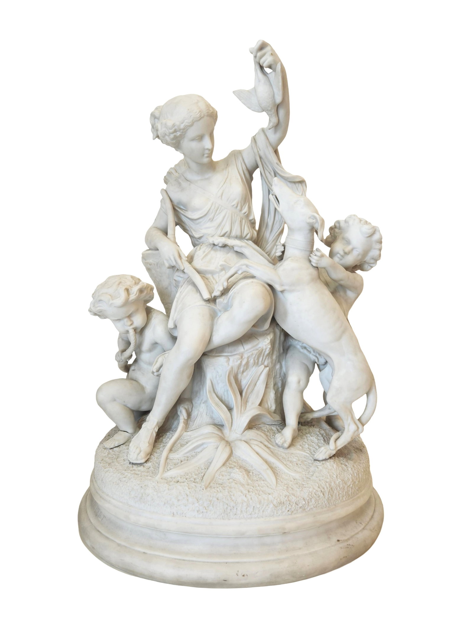 Theodore Hebert (French, 1829-1904) Bisque Sculpture Diana the Huntress with Putti: Exquisite hand-carved white Bisque group signed Theodore Hebert, depicting Diana the Huntress seated on a tree stump, holding a bird while a hound leaps beside her and two cherubic putti play at her f