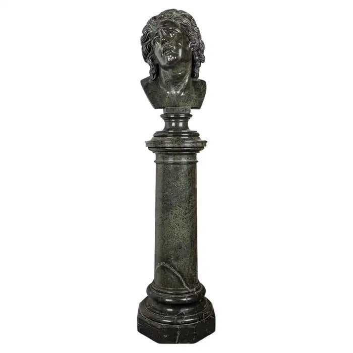 Antique 20th Century Italian Green Marble Life Size Bust On Stand c.1900: Crafted in the 20th Century, this Antique Italian green marble sculpture depicts the bust of a sorrowful young man gazing to his right. Resting upon a two-part pedestal crafted from Italian marble, th