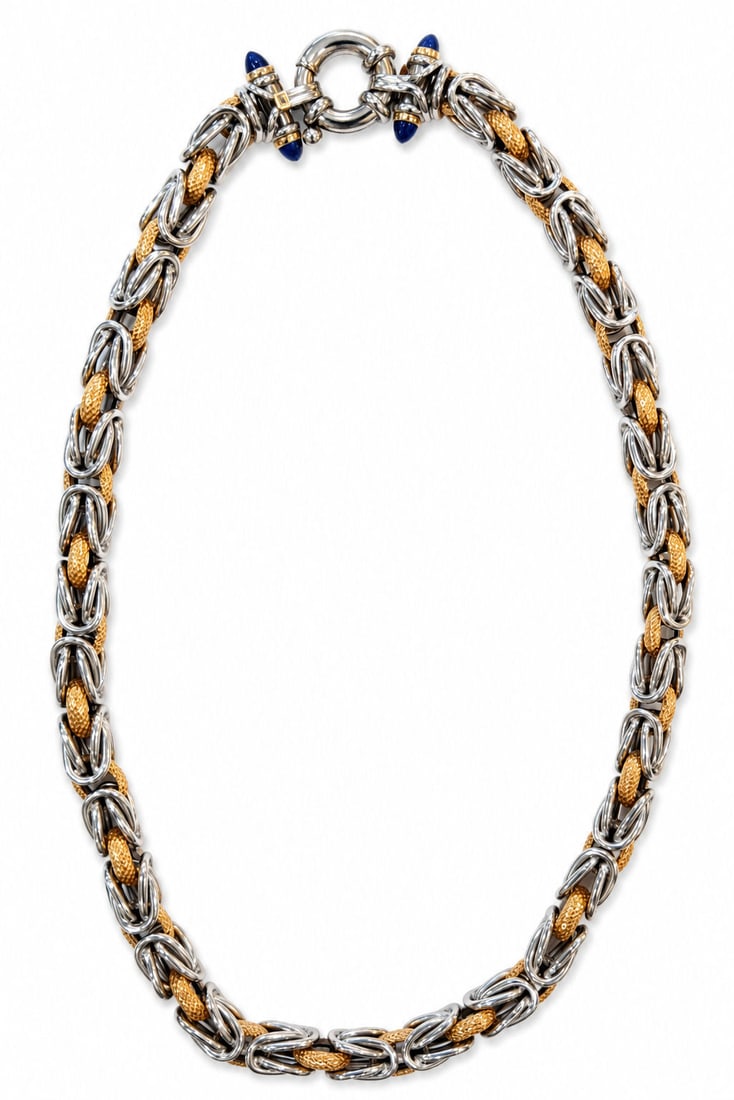 David Yurman 18K Yellow Gold, Sterling Silver & Lapis Lazuli Byzantine Necklace: Striking David Yurman necklace crafted in sterling silver and 18K yellow gold, showcasing the designer's iconic Byzantine link motif. The necklace features richly textured 18K yellow gold oval links i