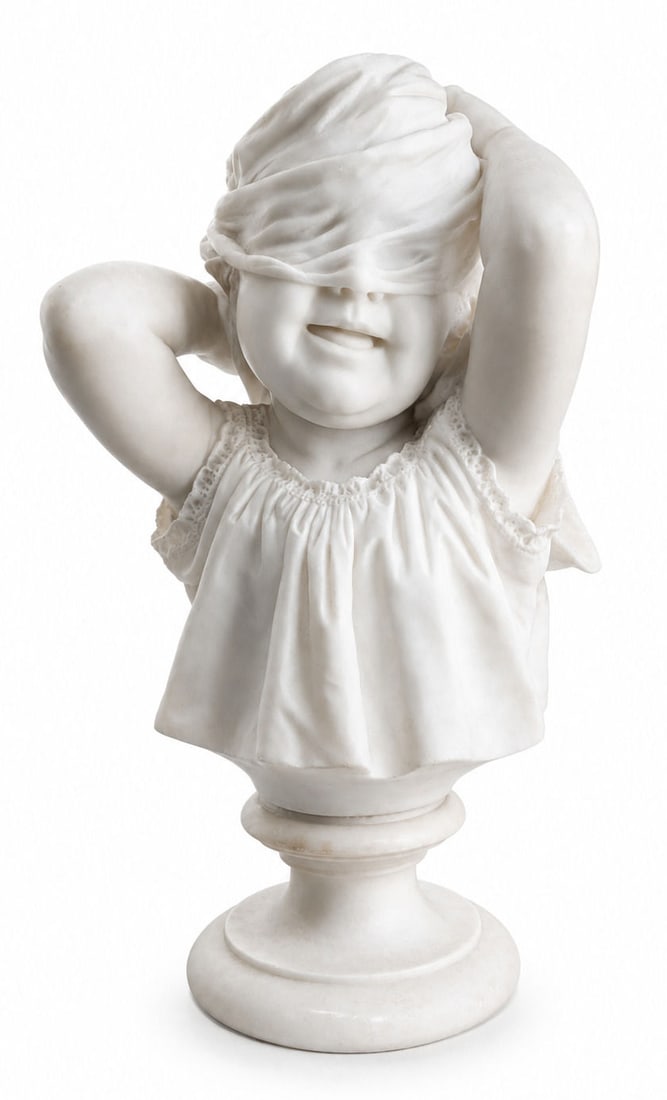 German Marble Bust of a Blindfolded Child on Pedestal, Early 20th Century: Charming German marble bust depicting a joyful young child playfully blindfolding themselves with a scarf tied around the head. Beautifully sculpted with a smiling expression, softly modeled features,