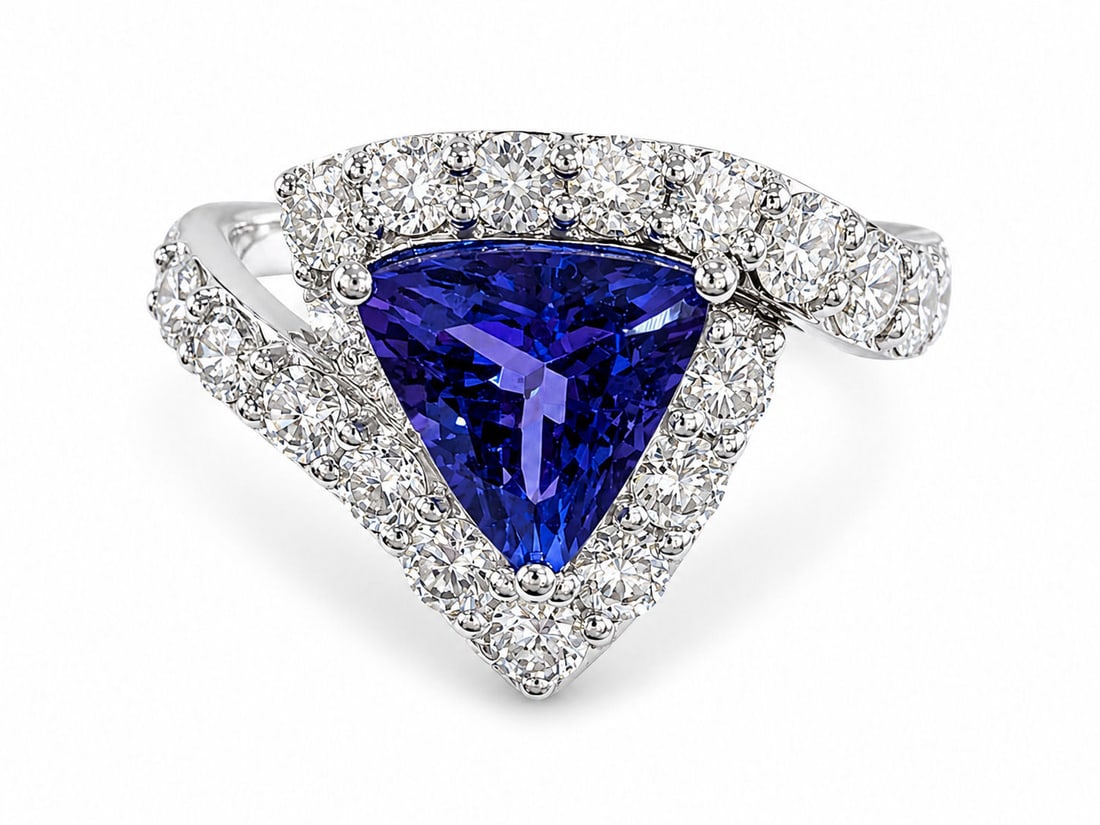 Oscar Friedman Platinum 2.55 Carat Tanzanite & Diamond Ring: Designer: Oscar Friedman Size: 6 3/4 Metal: Platinum ( PT950 ) Total Ring Gross Weight: 6.4 Grams Center Stone: One Trillion Cut Natural Tanzanite Center Tanzanite Weight: 2.55 Carats Center Tanzanite