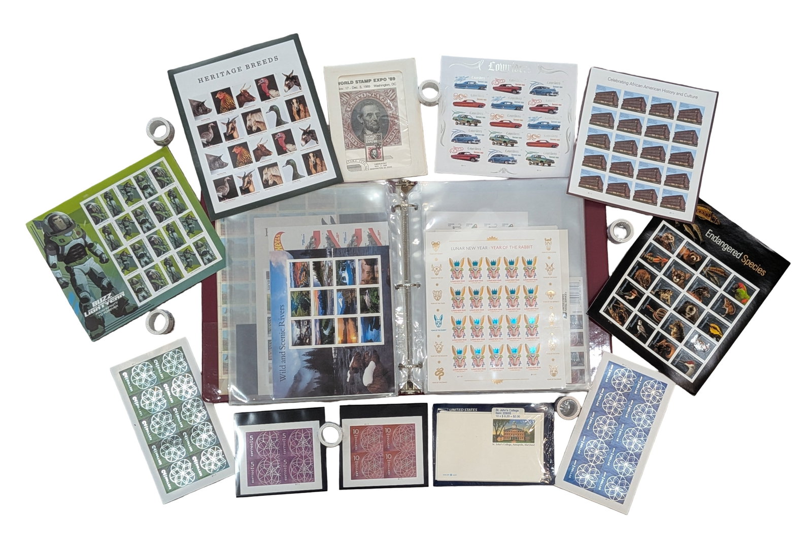 Large U.S. Postage Stamp Collection in Binder, Face Value Approx. $2,000: Extensive collection of modern United States postage stamps housed in a three-ring binder with protective archival pages. The collection includes a wide variety of mint sheets, souvenir sheets, bookle
