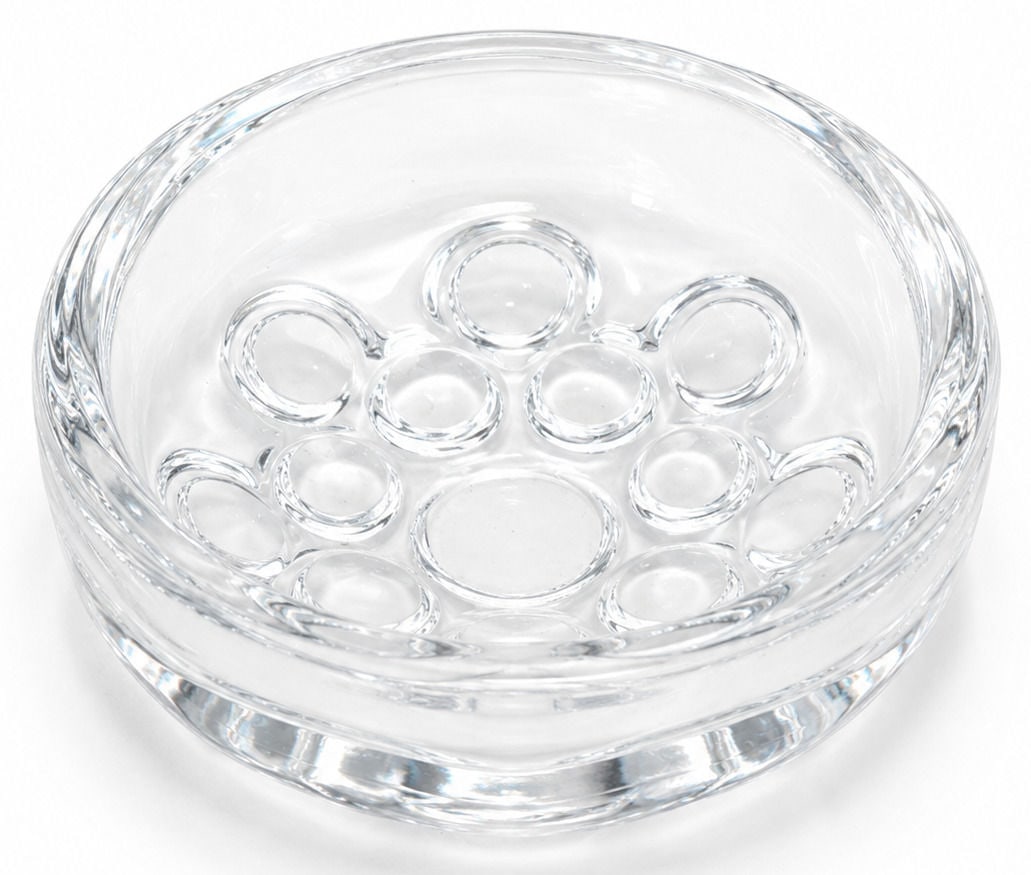 Modern Clear Crystal Art Glass Bowl: Modern clear crystal art glass bowl featuring a circular form with a series of polished oval and circular lens motifs radiating around the interior and exterior. Crafted from heavy, high quality cryst