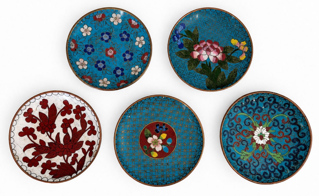 Collection of Five Chinese Cloisonne Enamel Coasters with Matching Stand: A collection of five vintage Chinese cloisonne enamel coasters accompanied by a matching cloisonne stand. Each coaster features a unique hand decorated floral or geometric motif in vibrant enamel colo