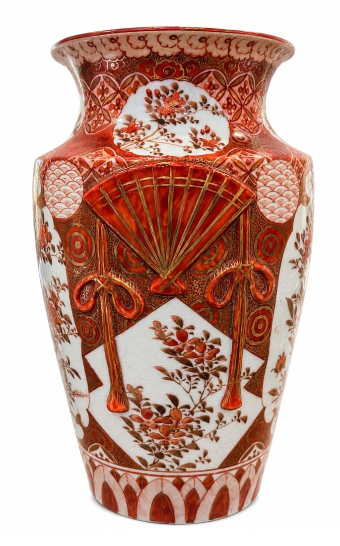 Japanese Meiji Satsuma / Kutani Iron Red Gold Baluster Vase: An fine antique Japanese porcelain baluster vase from the Meiji Period (1868 ? 1912) , decorated in rich iron-red (aka - e) enamels with extensive hand-painted gilded accents. The body features molded