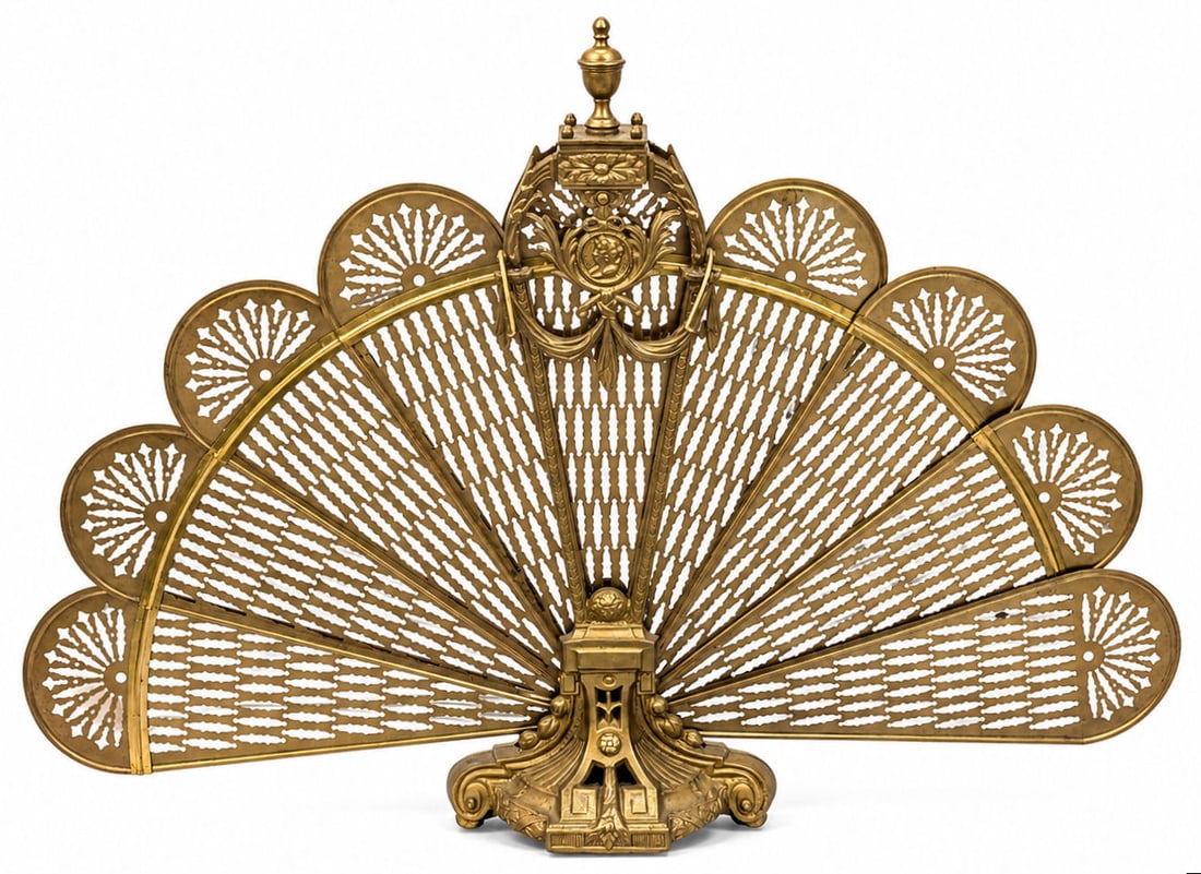 French Neoclassical Style Gilt Brass Folding Fan Fire Screen: An ornate 19th century French Neoclassical style gilt brass peacock / folding fan fireplace screen featuring nine pierced reticulated mesh blades that pivot smoothly into a central pedestal stand. The