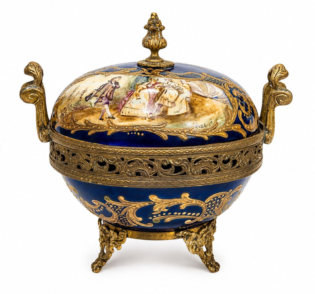 Hand-Painted Sevres Porcelain and Ormolu Covered Bowl Signed H. Varnet: A stunning 19th century French Sevres porcelain covered bowl featuring a finely hand-painted Rococo courting scene, signed H. Varnet. The domed lid and cobalt blue body are richly decorated with intri
