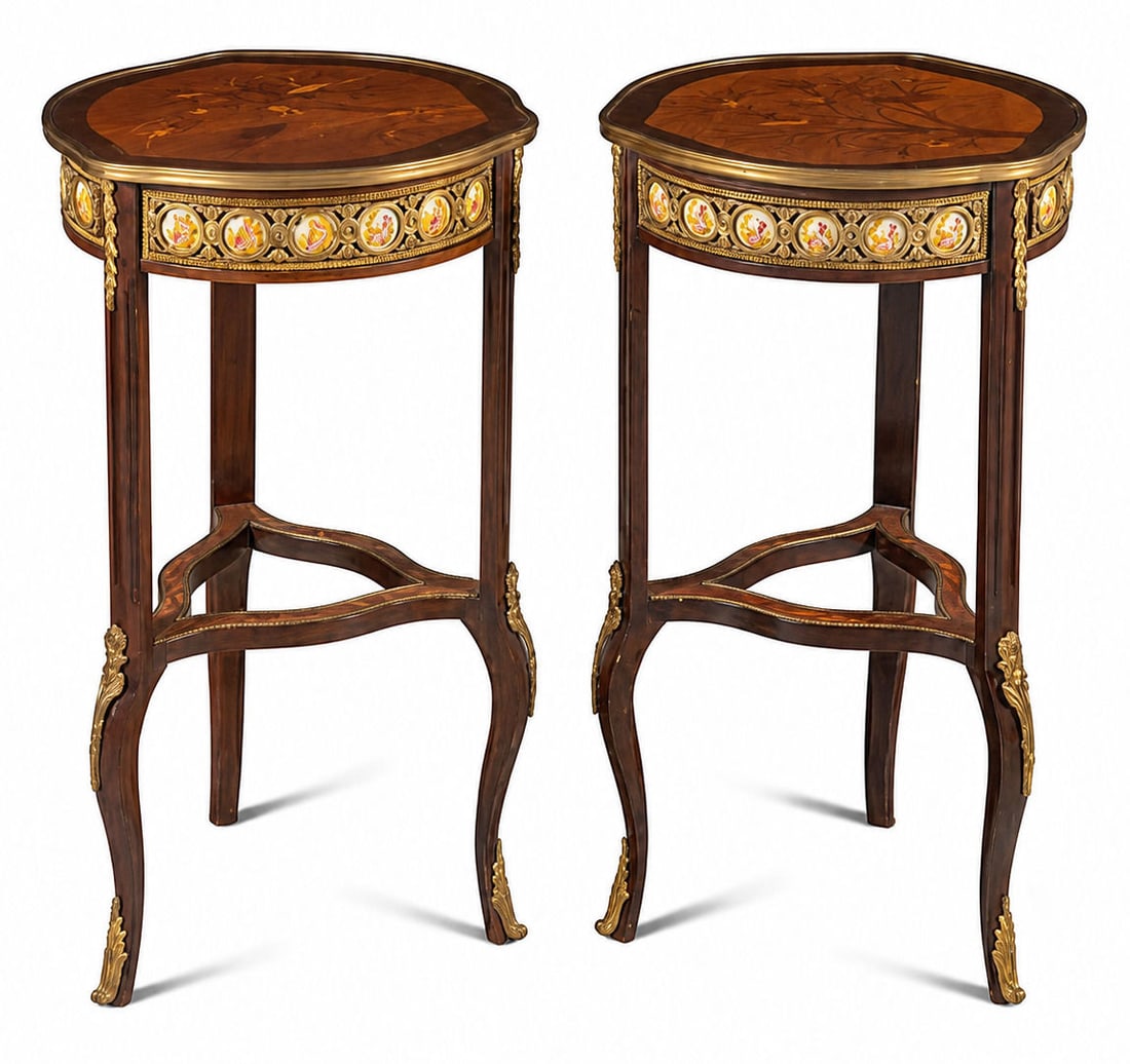 Pair of French Louis XV Style Marquetry & Ormolu Mounted Pedestal Tables with Porcelain Plaques: A fine pair of French Louis XV style marquetry inlaid and ormolu mounted tall side tables (gueridons), featuring shaped trefoil tops adorned with detailed wood marquetry depicting birds perched on flo