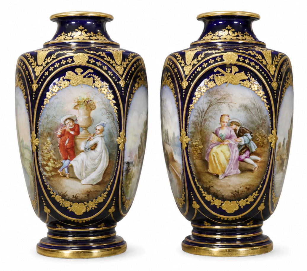 Pair of French Sevres Cobalt Blue Hand Painted Porcelain Vases Signed: An exquisite pair of late 19th century French Sevres cobalt blue porcelain vases of faceted hexagonal form, artist signed and decorated with opulent gilt embellishments. Against a deep cobalt blue gro