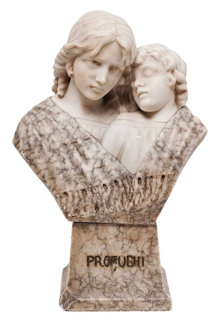 Italian Art Nouveau Carved Marble Bust Titled " Profughi ": An Italian turn of the century Art Nouveau carved marble figural bust depicting a tender embrace between two young figures, titled " Profughi " (Refugees). Rendered in contrasting patterned grey veine