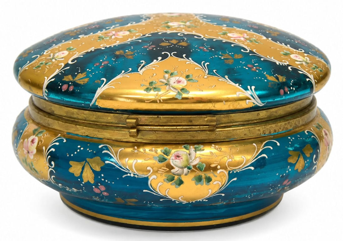 Antique Moser Bohemian Teal Blue Glass Hinged Dresser Box: A fine 19th century Bohemian glass hinged dresser or trinket box by Moser, crafted in rich teal blue glass. The domed lid and rounded lower body are decorated with lavish hand painted enameling, featu