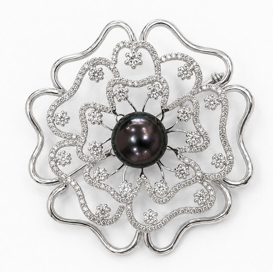 14K White Gold Tahitian Pearl & Diamond Floral Brooch: Metal: 14K White Gold Total Brooch Gross Weight: 12.3 Grams Center Stone: One Cultured Tahitian Pearl Pearl Size: 10.5 mm Pearl Color: Black with Purple Overtone Pearl Luster: Excellent Pearl Surface: