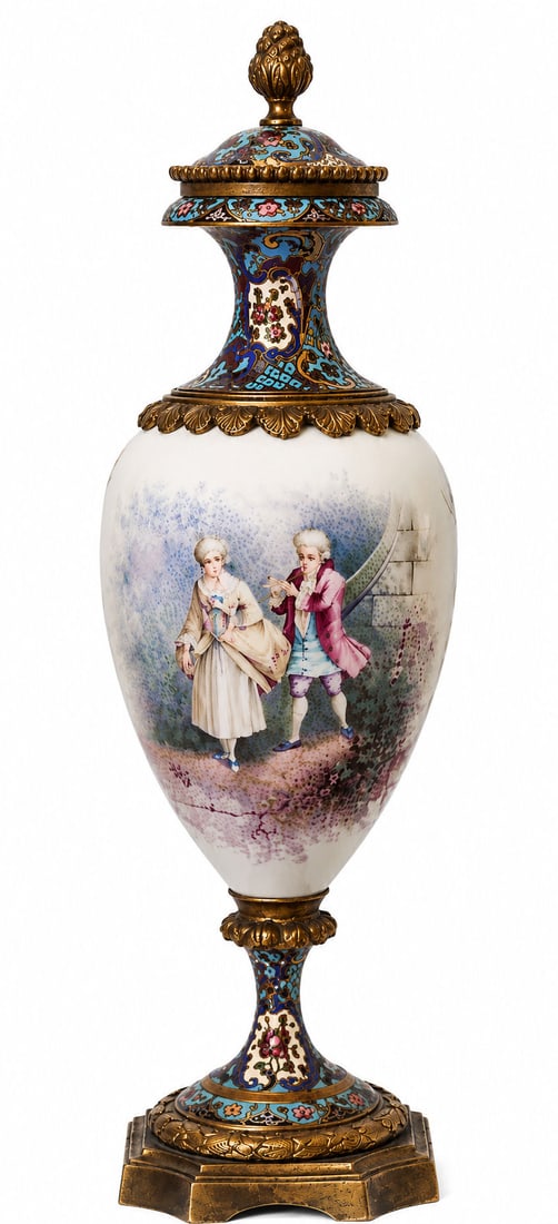 French Sevres Porcelain and Champlev Enamel Mounted Covered Urn, 19th Century: French decorative covered urn featuring a Sevres porcelain body finely painted with a romantic figural scene of a courting couple in 18th-century dress. The porcelain body is mounted with richly decor