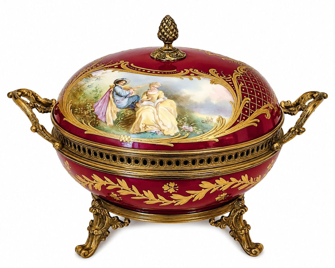 Sevres Hand-Painted Porcelain Box with Gilt Bronze Mounts, Chateau de Longpre Mark: Charming Sevres hand-painted porcelain lidded box, richly decorated with a romantic courting scene on the cover, framed by intricate raised gilt accents over a deep ruby red ground. The body is furthe
