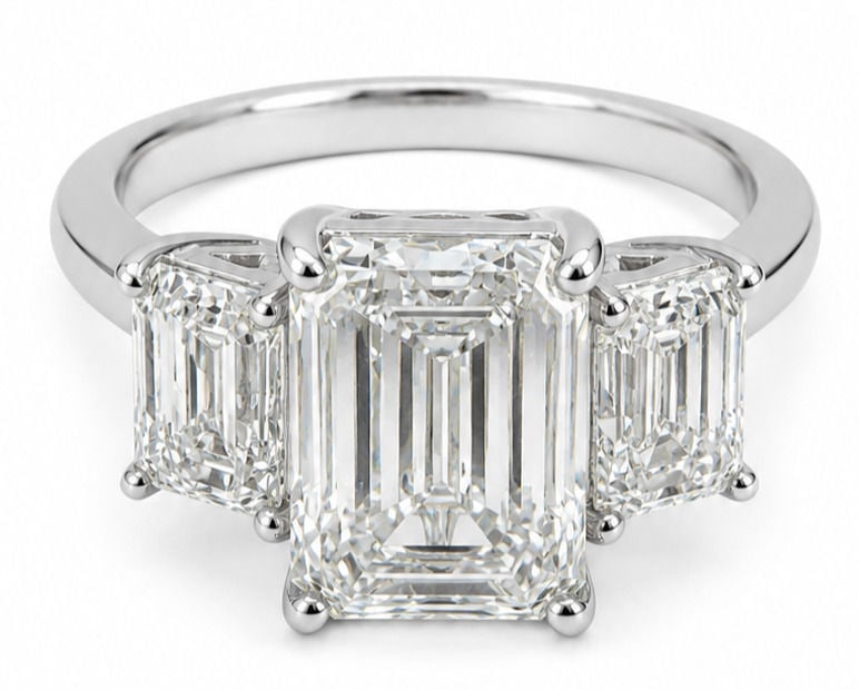 Oscar Friedman 14K White Gold Three-Stone Laboratory-Grown Diamond Ring: Designer: Oscar Friedman Size:6 3/4 Metal: 14K White Gold Total Ring Gross Weight: 7.09 Grams Center Stone: One Emerald Cut Laboratory Grown Diamond Center Diamond Weight: 5.01 Carats Center Diamond C