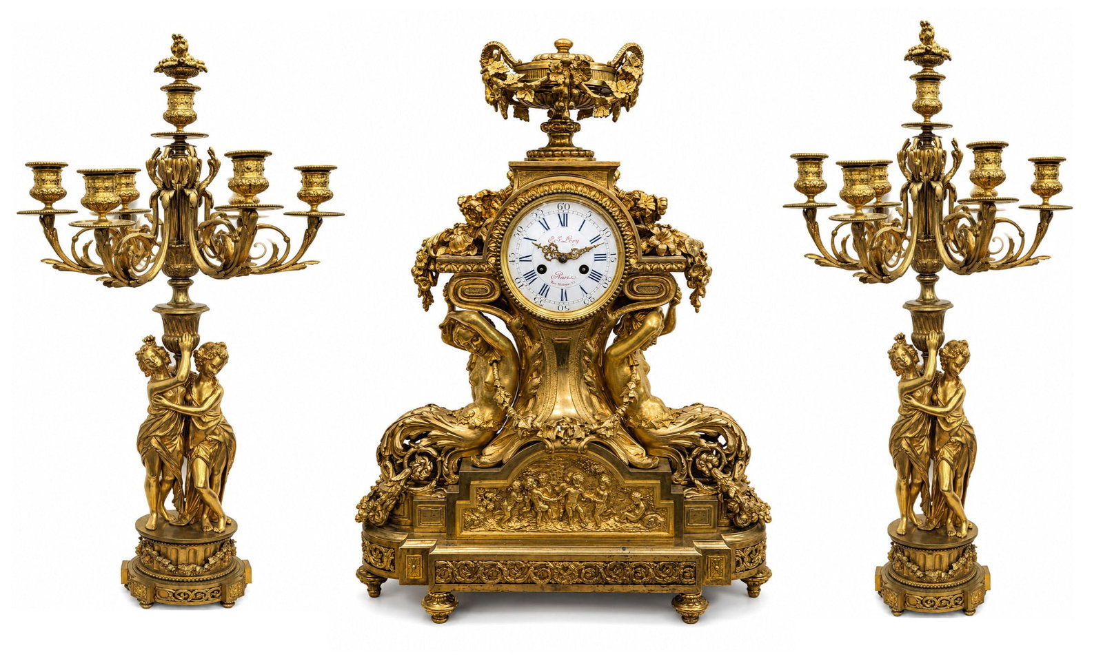 19th Century French Louis XVI Gilt Bronze Mantel Clock Garniture by G. J. Levy, Paris: An exceptional 19th century French Louis XVI gilt bronze (ormolu) mantel clock garniture comprising a central mantel clock and a matching pair of five light candelabra. Richly cast and finely chased, 