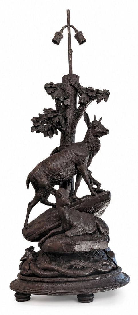 19th Century Black Forest Hand Carved Wood Chamois Table Lamp: Antique 19th century Black Forest hand-carved linden or walnut wood table lamp depicting a family of chamois (or ibex ) set upon a naturalistic Alpine rock formation beneath a richly carved oak tree. 