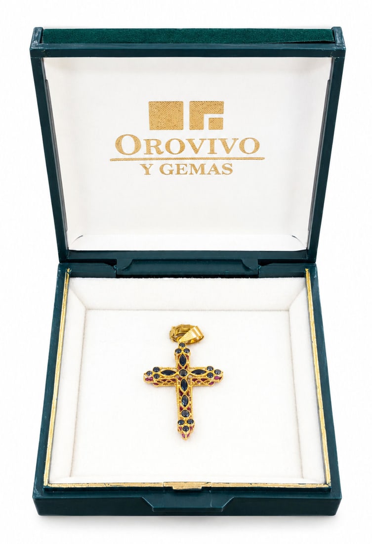 Orovivo Y Gemas 18K Yellow Gold Reversible Ruby & Blue Sapphire Cross Pendant: A fine 18K yellow gold cross pendant by Orovivo Y Gemas featuring a fully reversible dual-sided design. One side is set with 19 natural marquise and round-cut blue sapphires, while the reverse side fe