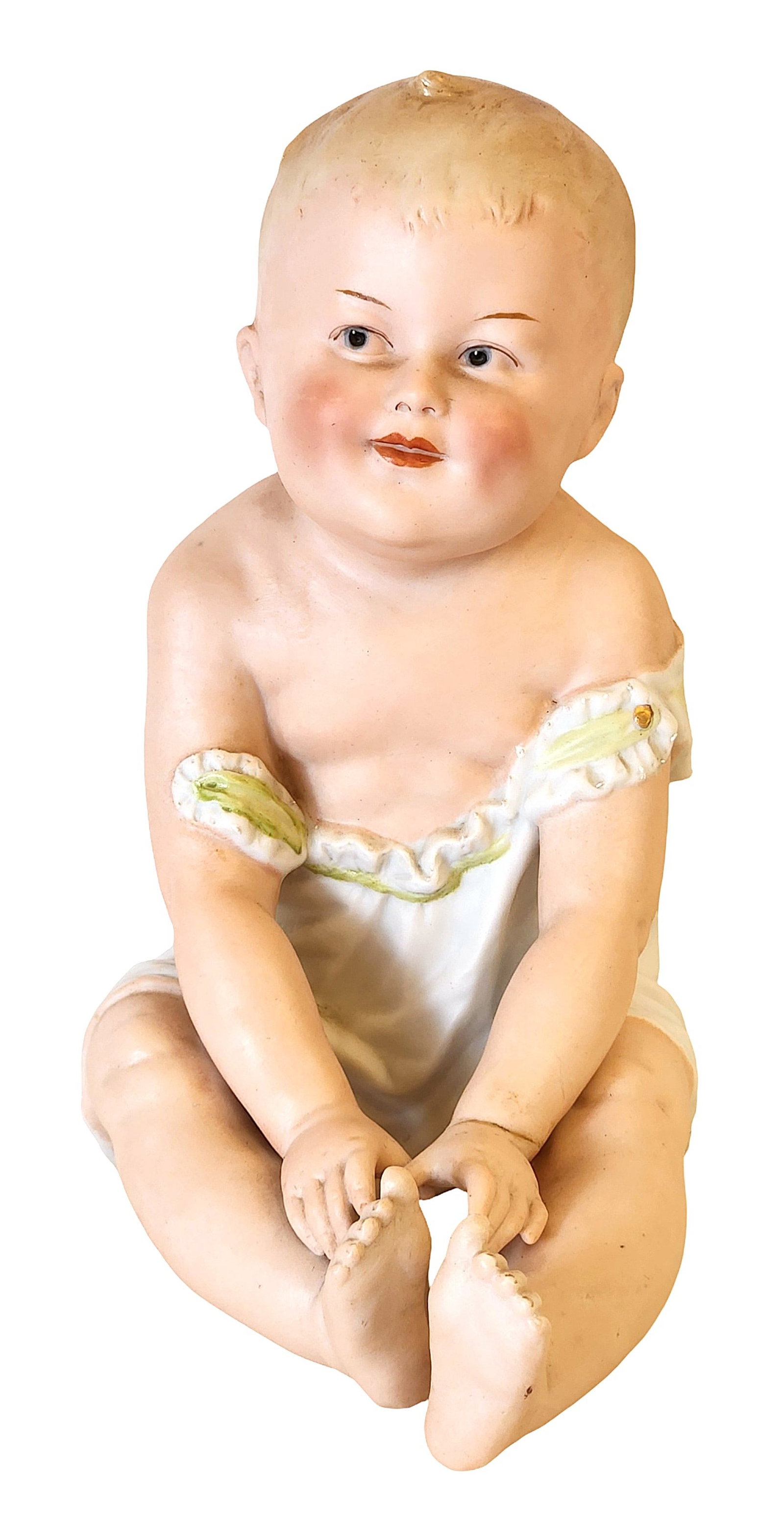 Antique German Bisque Baby Doll Figurine Heubach Style Marked Made in Germany: Charming antique German bisque porcelain baby doll figurine featuring a sweet seated child in a delicate white romper with green trim. The baby has softly molded features, hand-painted facial details,
