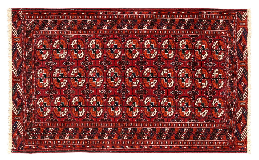 Hand-Woven Bukhara Oriental Wool Area Rug: A hand-woven Oriental rug featuring a rich crimson field decorated with repeating octagonal gul medallions in cream, black, and rust tones. The classic geometric composition is framed by multiple guar