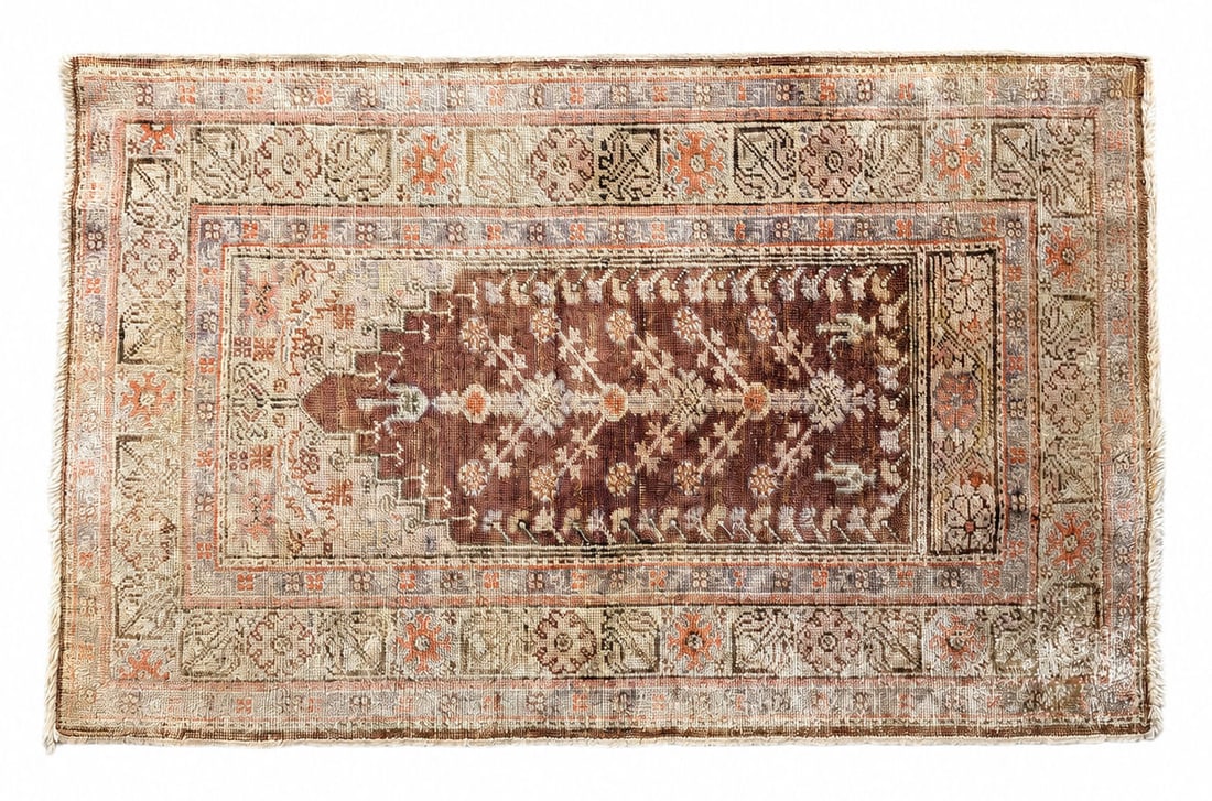 Antique Anatolian Prayer Rug, Hand-Knotted Wool with Mihrab Design: Antique hand-knotted Anatolian prayer rug featuring a traditional mihrab (prayer niche) design rendered in soft, muted tones of ivory, cream, rust, pale blue, and warm brown. The central field display