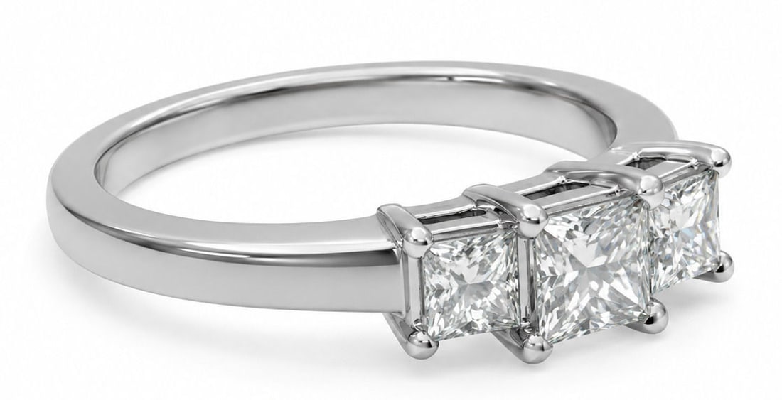 14K White Gold Princess Cut Three-Stone Diamond Ring: Metal: 14K White Gold Size 6 3/4 Weight 3.2g Total Diamond Weight: Approx. 1 CTW Center Diamond: Princess Cut Side Diamonds: Two Princess Cut Diamonds Setting: Three-Stone, Four-Prong