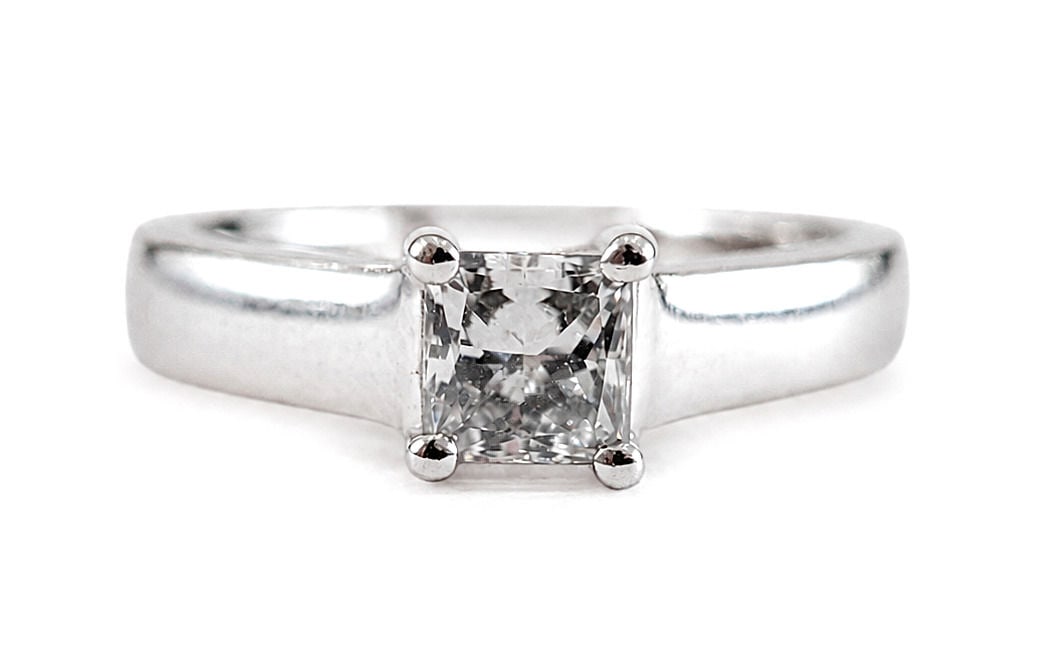 14K White Gold Princess Cut Diamond Solitaire Engagement Ring: Metal: 14K White Gold Size 5 1/2 Weight 4.3g Total Diamond Weight: Approx. 0.5 Carat Diamond Shape: Princess Cut Setting: Four-Prong Solitaire Style: Cathedral Engagement Ring Interior Engraving: "I L