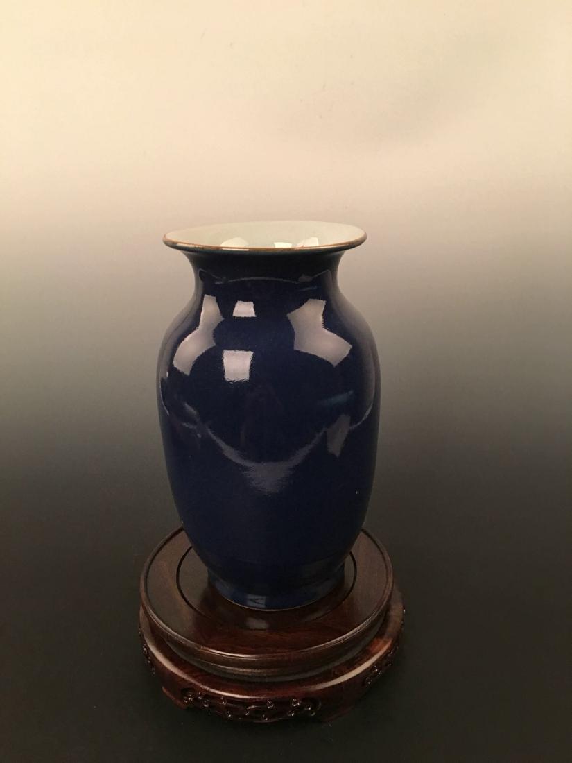 Blue Glazed Vase with QianLong Mark: Blue Glazed Vase with QianLong Mark 11" H X 6-1/4" W, 4.8 Lbs Shipping: We are able to pack and ship this item to an address in the United States for $30.00 via UPS Ground or USPS Priority Mail. Track