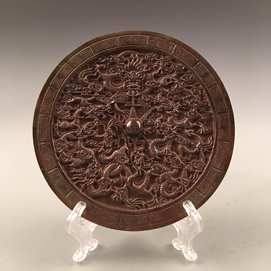 Chinese Bronze Mirror: Chinese Bronze Mirror D. 7-1/2''; 2.6 lb Shipping: We are able to pack and ship this item to an address in the United States for $30.00 via UPS Ground or USPS Priority Mail. Tracking information will 