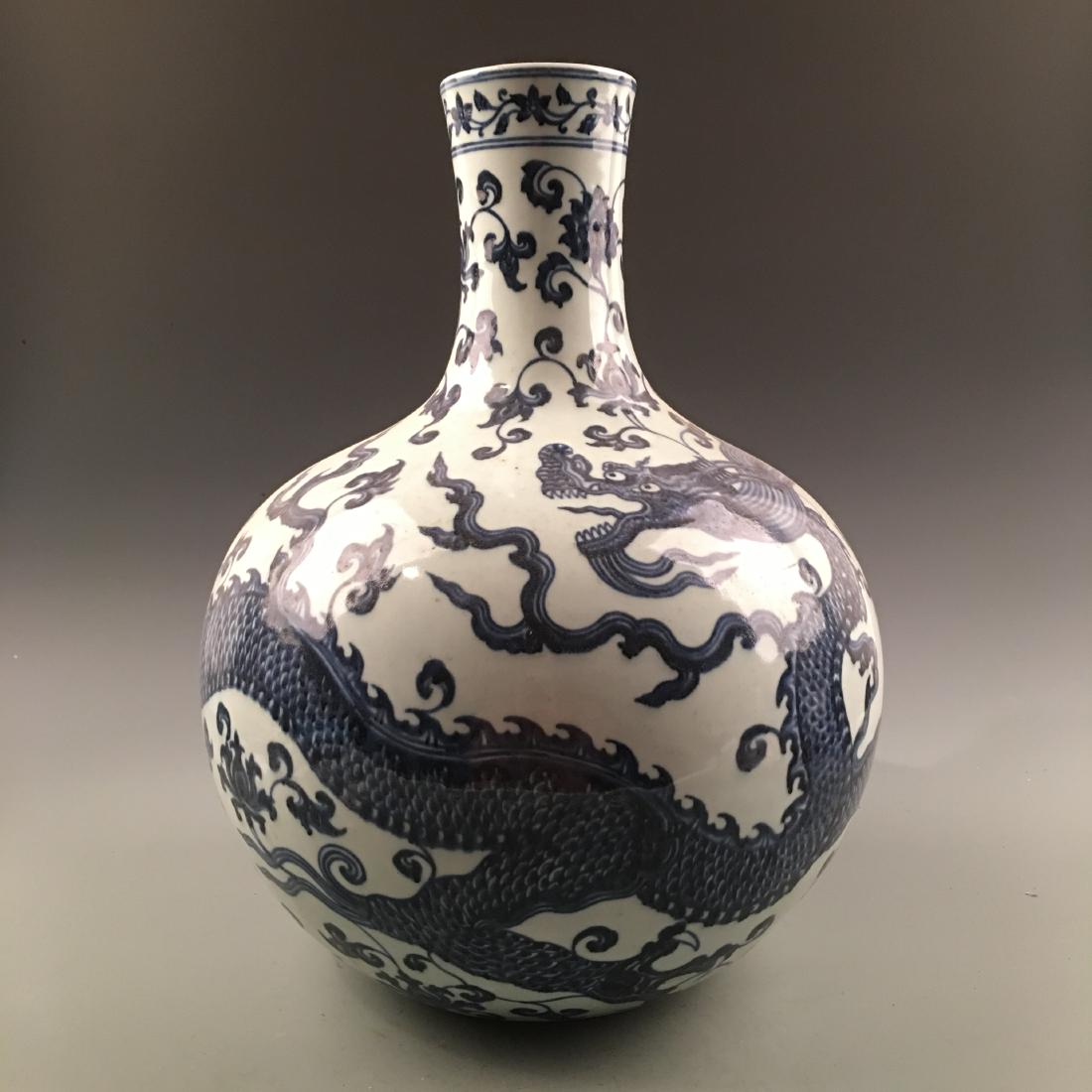 Chinese Blue-White 'Dragon' Globular Vase: Chinese Blue-White 'Dragon' Globular Vase 17-1/2'' H, 12-1/2'' W; 15.2 lb Shipping: We are able to pack and ship this item to an address in the United States for $45.00 via UPS Ground or USPS Priority