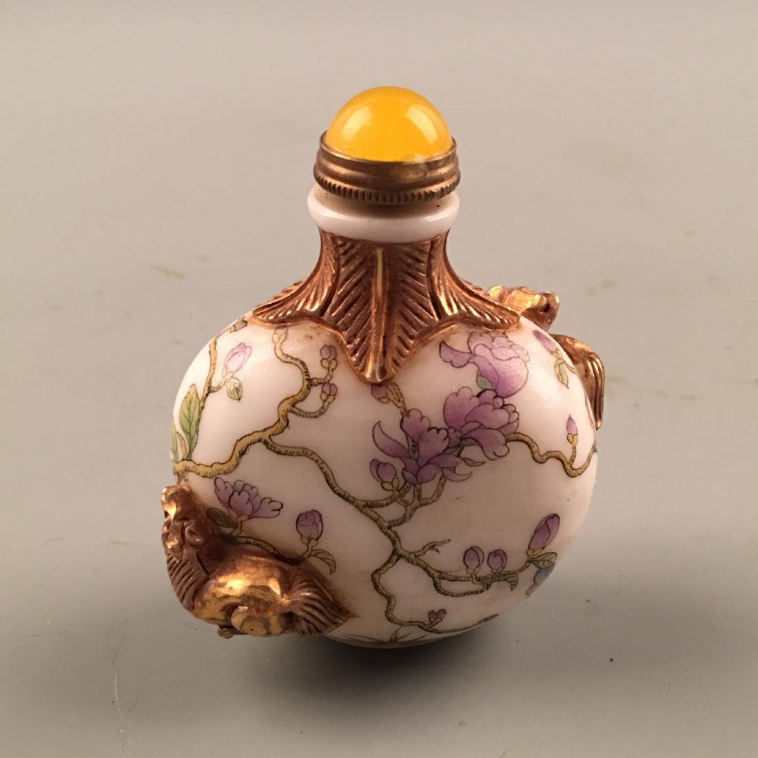 Chinese Enamel Snuff Bottle: Chinese Enamel Snuff Bottle 3-1/8'' H, 2-3/8'' W; 109 g Shipping: We are able to pack and ship this item to an address in the United States for $20.00 via UPS Ground or USPS Priority Mail. Tracking in